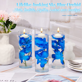 Hanaive wedding table centerpiece with blue orchids and candles enhances atmosphere.