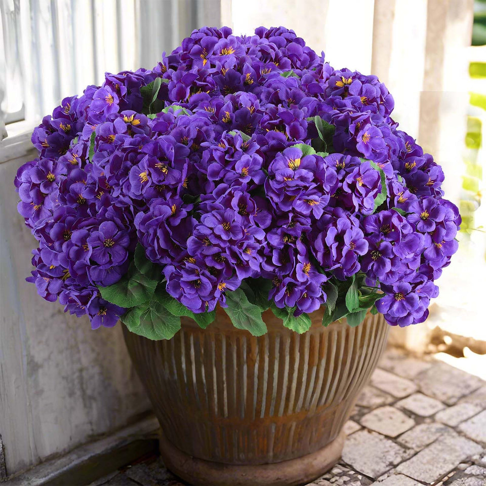 Hananona artificial geraniums outdoors with vivid purple blooms for low-maintenance decor.