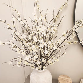 HANDIC cherry blossom branch closeup with white blooms highlighting lifelike detail.