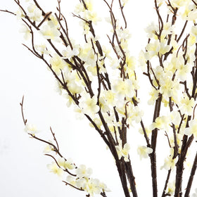 HANDIC cherry blossom branches in vase setup showing flexible stems for arrangements.