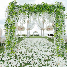 HANDIC Wisteria garland 5-pack 33ft draped over arch for romantic wedding ambiance.