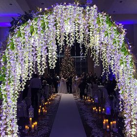 HANDIC Wisteria Garland enhancing indoor decor with vibrant purple vines.
