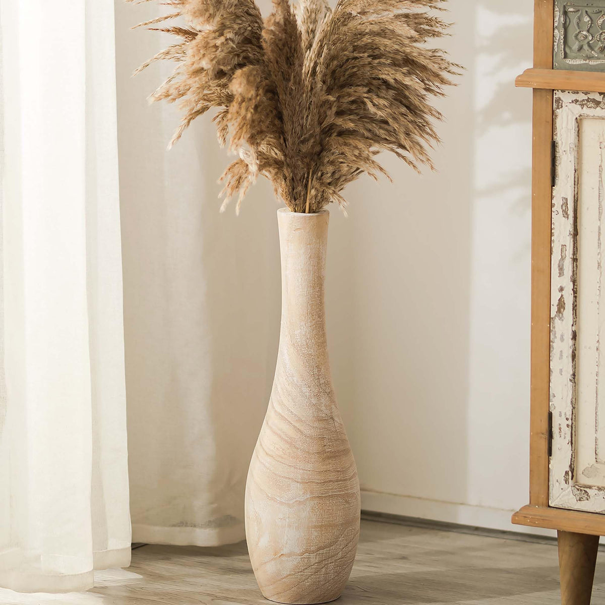 Hanobe 22-inch floor vase in natural wood, bold living room centerpiece idea