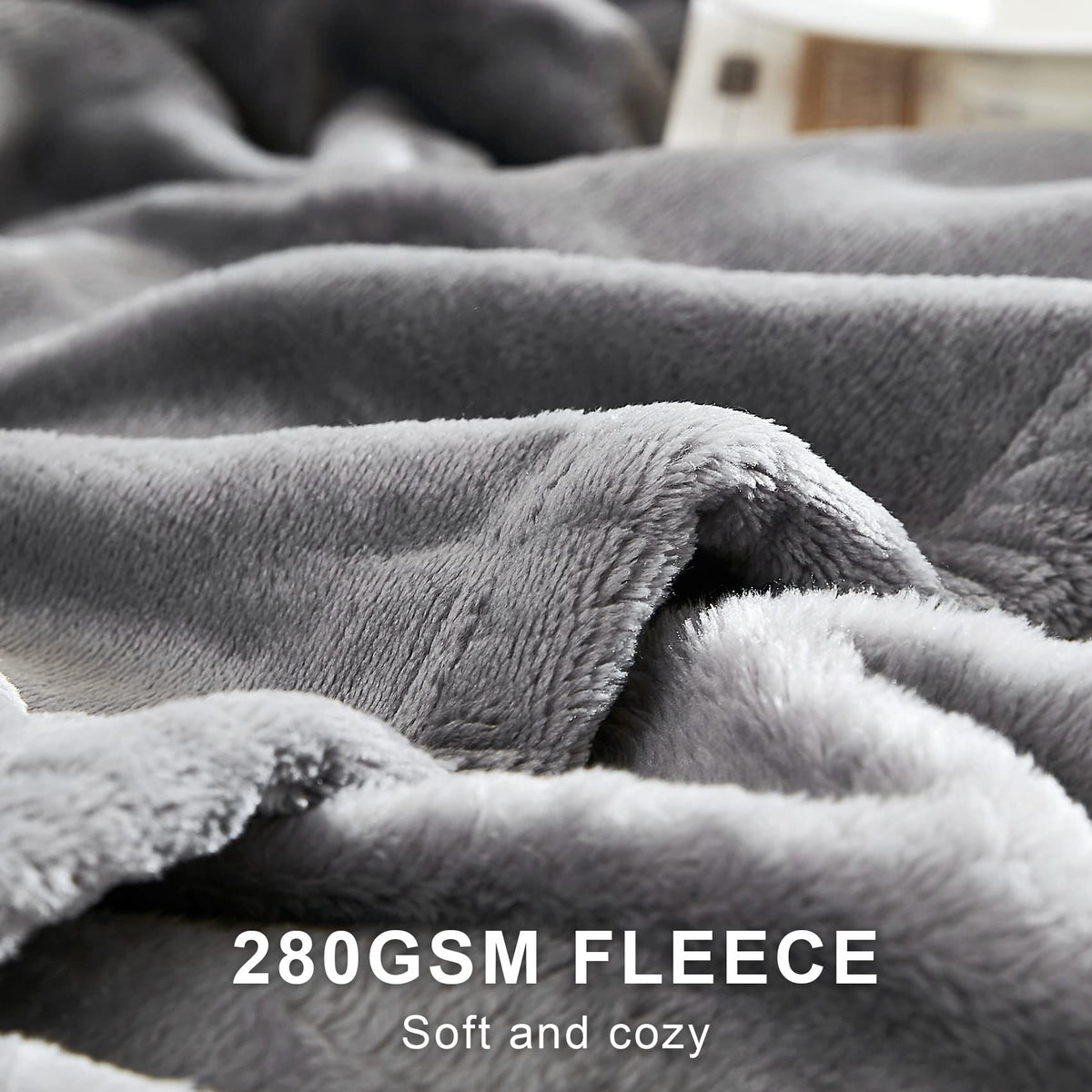 Hansleep king-size gray blanket draped over bed for all-season comfort