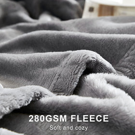 Hansleep king-size gray blanket draped over bed for all-season comfort
