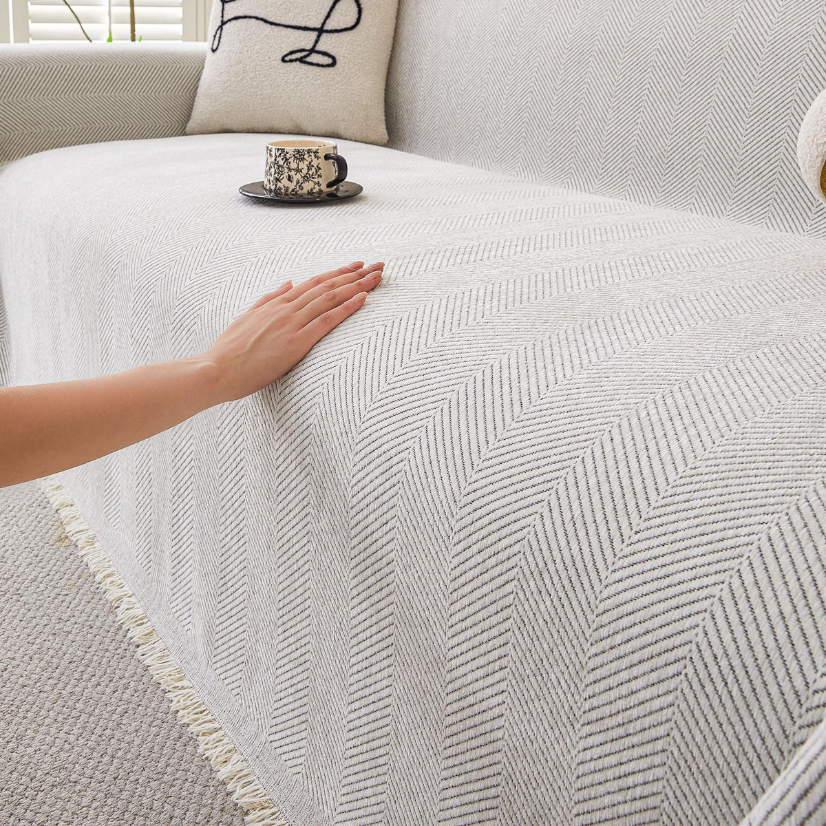 HAOMAIJIA non-slip couch cover for 3-cushion sofas prevents shifting during seating.