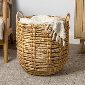 Styled in a living room setup to show practical organization with this basket.