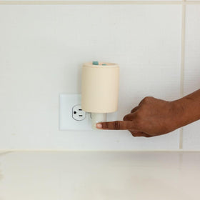 Happy Wax Bone ceramic finish complements decor while warming scents.