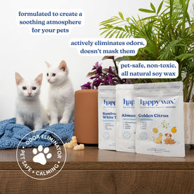 Happy Wax Pet Scents Bamboo White Tea melts beside a warmer for calming, pet-safe fragrance.
