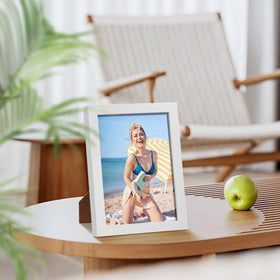 Engineered wood frame in white finish supports your memories.