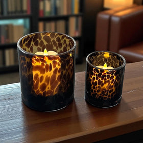 Hapton House animal print glass candle holder creates cozy dining table vibe.