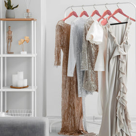 HARDW Cedar hangers with non-slip pant bar keep trousers in place.