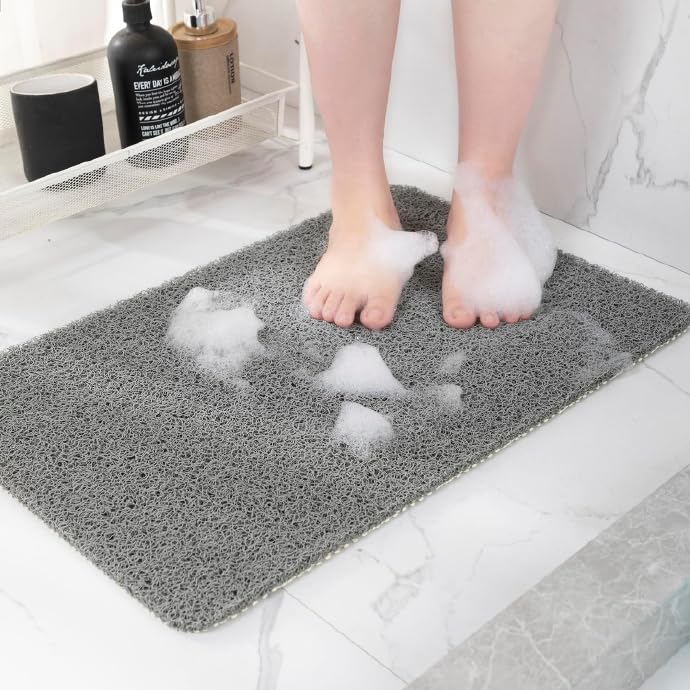 Hargiis non-slip bath mat in grey with checkered backing for safe bathroom footing.