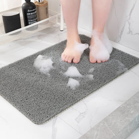 Hargiis non-slip shower mat in gray laid flat for bathroom safety.