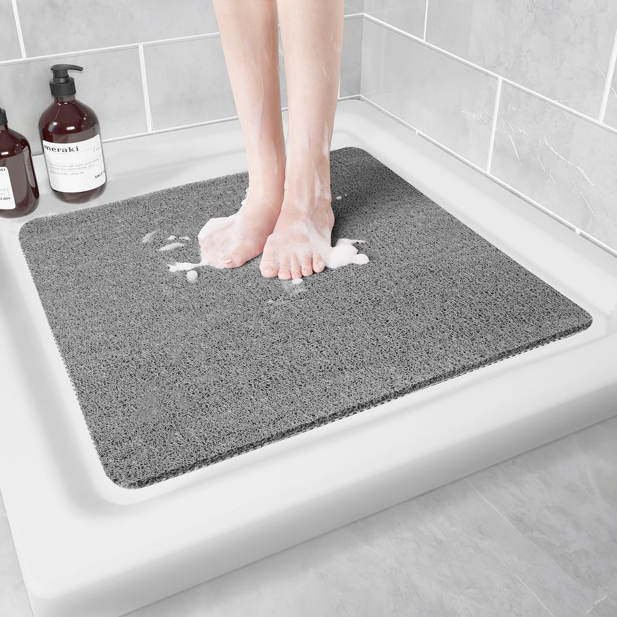 Hargiis non-slip shower mat in grey 24x24 provides safer footing.