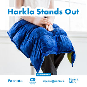 Kid resting the Harkla Lap Pad on their lap during activity.