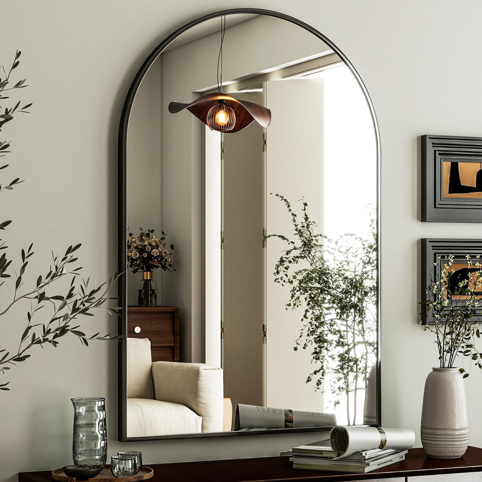 HARRITPURE arched mirror in a black frame suitable for bedrooms and bathrooms.