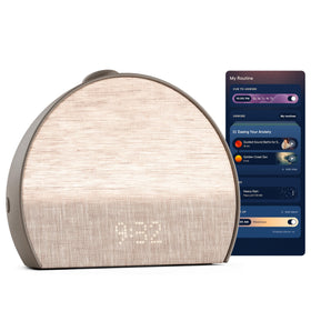 Hatch Restore 3 Cocoa on nightstand with sunrise alarm guiding morning light