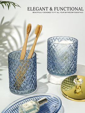 Haturi blue glass Q-tip holder organizes vanity neatly.