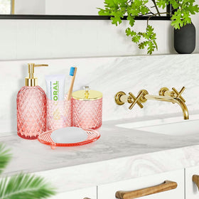 Haturi pink glass vanity tray enhances counter organization with stylish gold accents