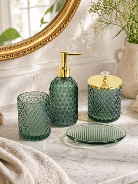 Haturi sage green glass bathroom set on counter enhances cohesion.