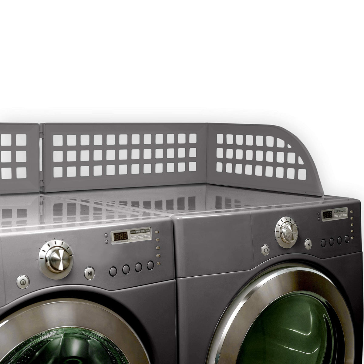 Haus Maus Laundry Guard on a front-loader with magnets gripping metal surfaces.