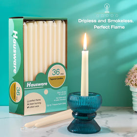 Hausware ivory taper candles displaying a clean, steady flame for dining ambiance.