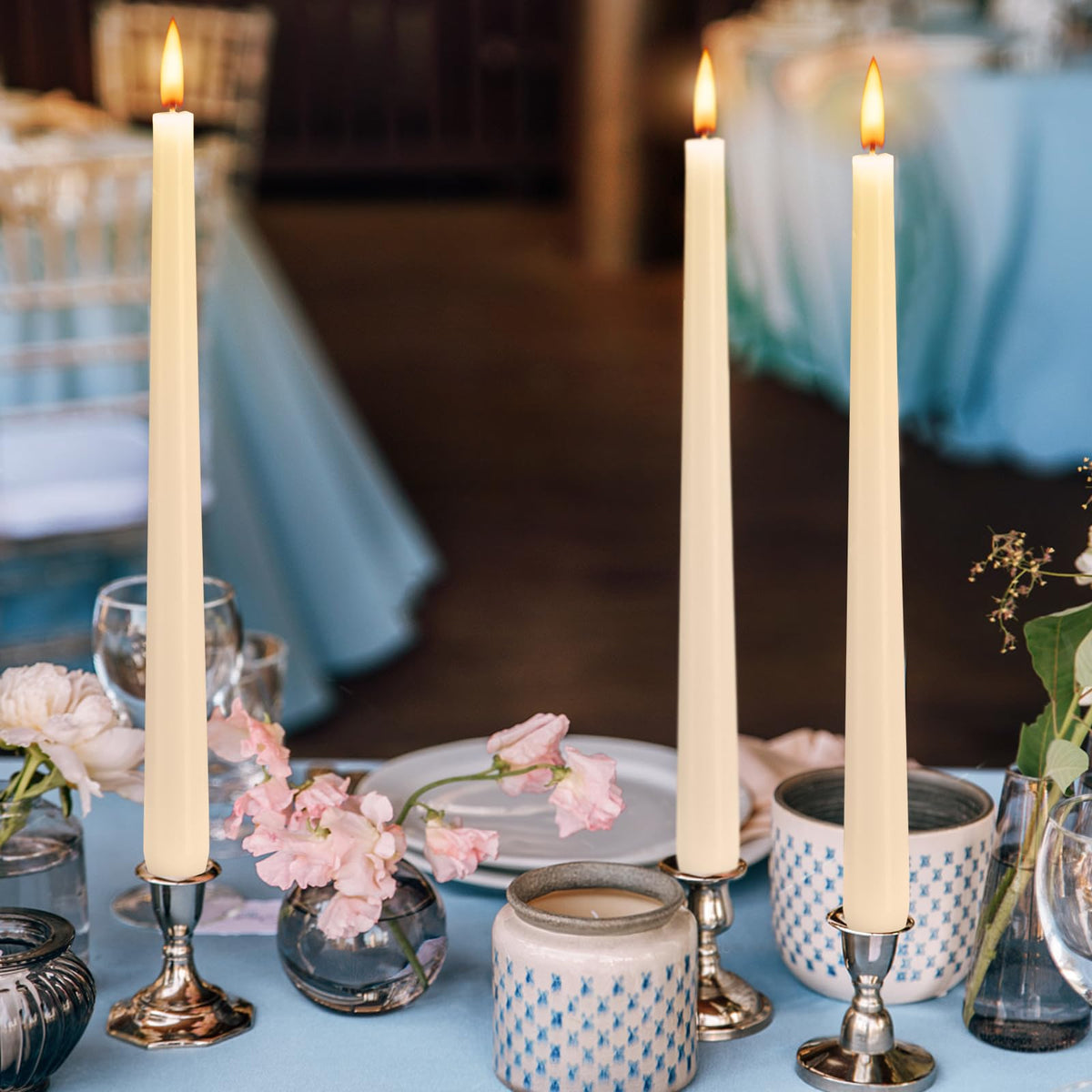 Hausware ivory taper candles used as wedding decor for timeless lighting.