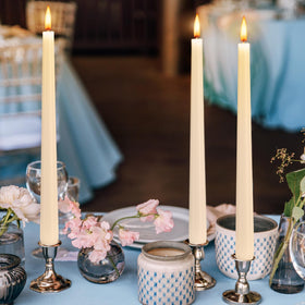 Hausware ivory taper candles used as wedding decor for timeless lighting.