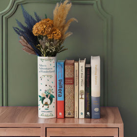Hazel & Harold's book vase features ribbed detailing and glazed finish.