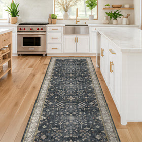 Hazo Haus rug displays distressed charcoal base with beige and ivory accents