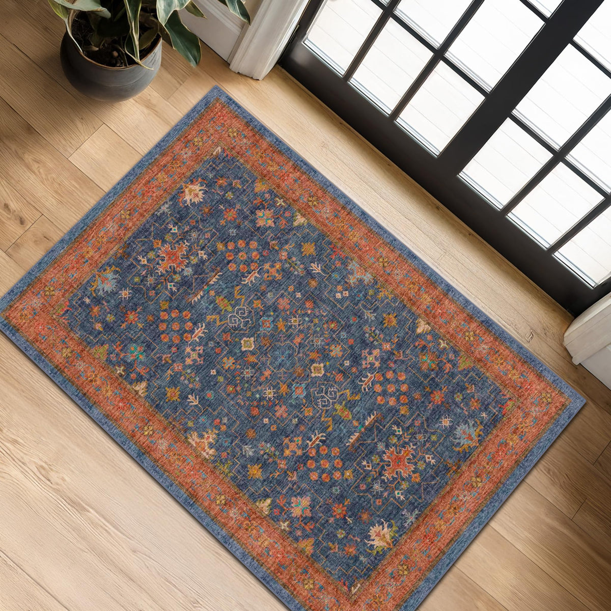 Hazo Haus navy blue entry rug at the front door with non-slip backing