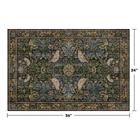 Hazo Haus rug featuring bird motif and botanical pattern close-up