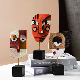 HCCMLOVE Wink African art-inspired figurine enhances focal points in decor.