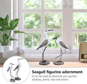 Standing seagull statue on mantel adds coastal centerpiece.
