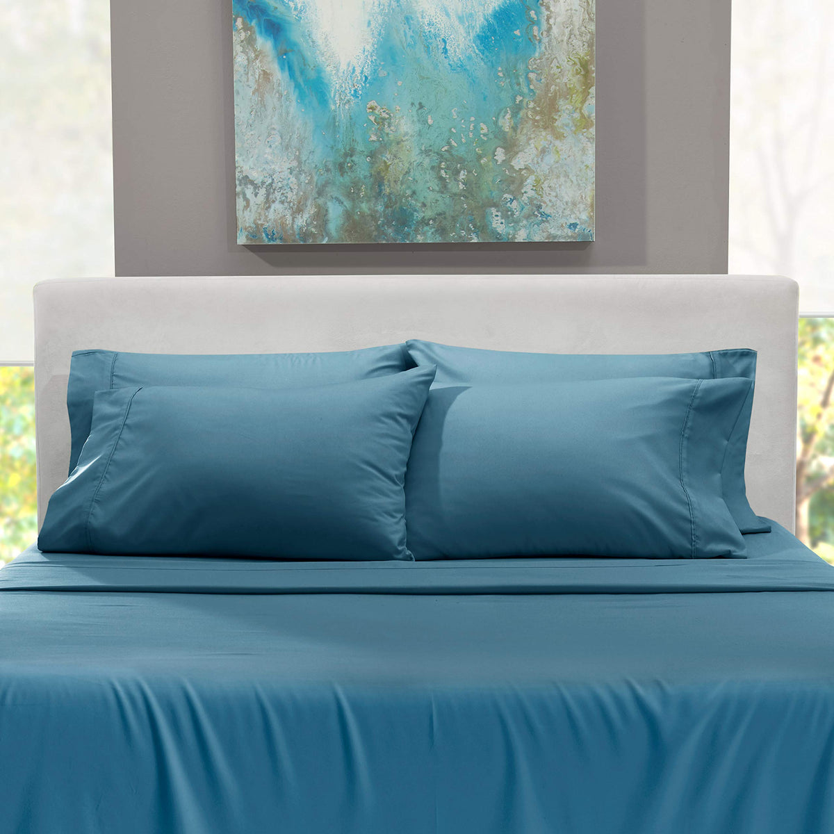 Display shot of Hearth & Harbor 6-piece set in Blue Heaven on a bed.