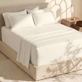 Hearth & Harbor flat sheet draped over a large bed for generous coverage