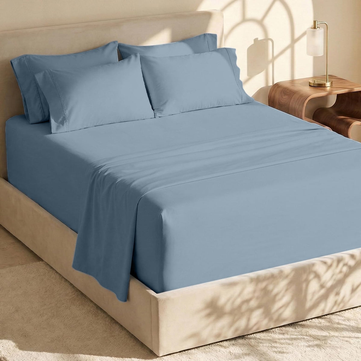 Hearth & Harbor bed sheets in soft blue folded, showcasing premium microfiber softness.