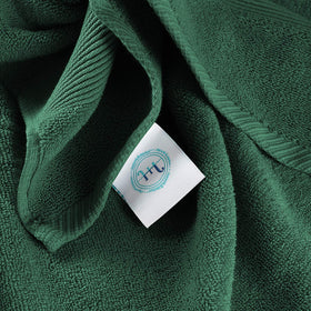 Hearth & Harbor hunter green towel display, elegant bathroom accent.