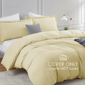 Hearth & Harbor Vanilla Yellow pillow shams on bed with overlap closure.