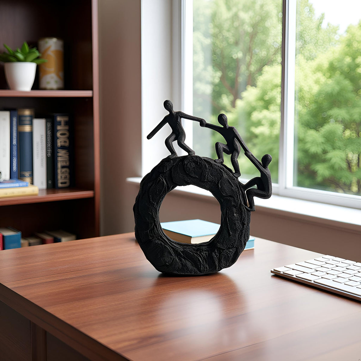 Hebdids circle-base sculpture showing stable base for secure shelf display.