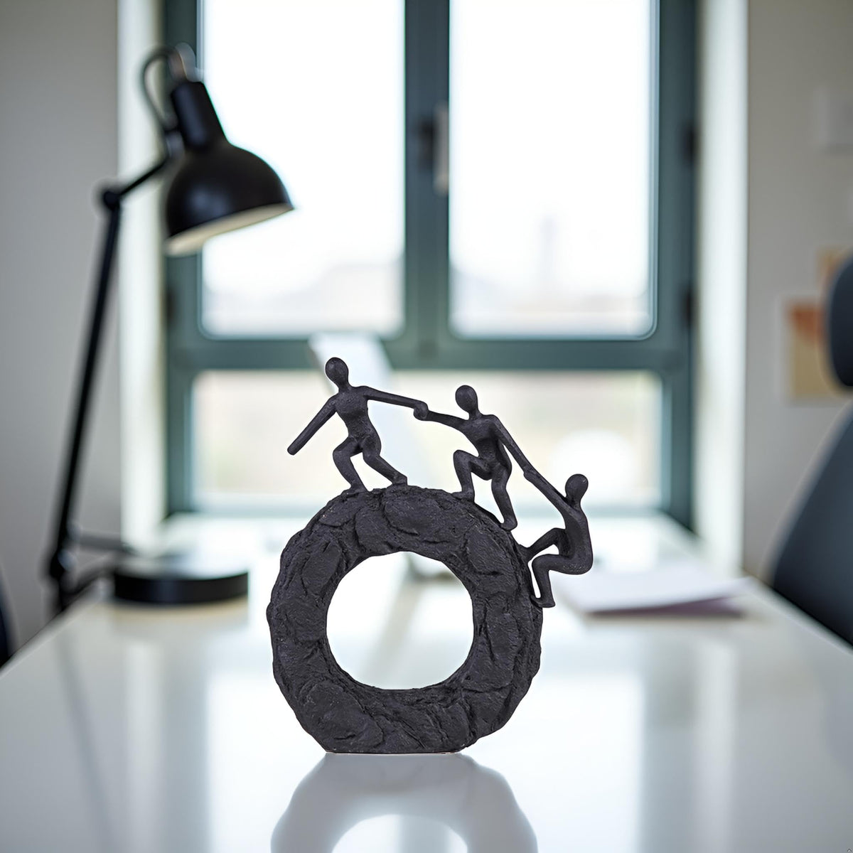 Hebdids matte-black finish sculpture adds depth and sophistication to any room.