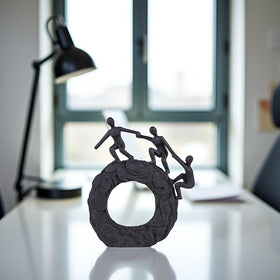 Hebdids matte-black finish sculpture adds depth and sophistication to any room.