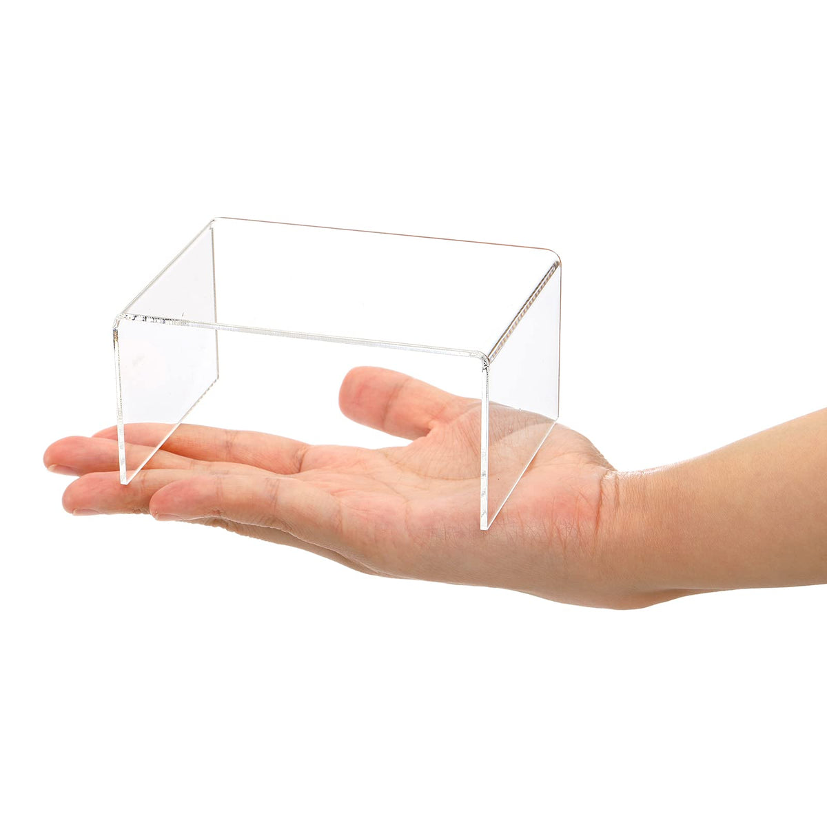 Hedume jewelry display on clear risers highlights sparkle and arrangement