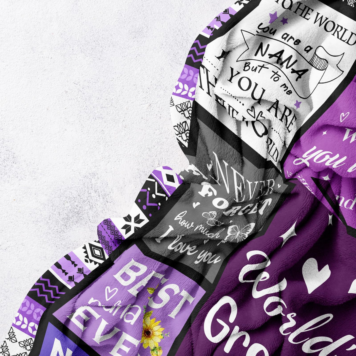Folded Henazin Nana Gifts Blanket in purple, compact gift-ready presentation.