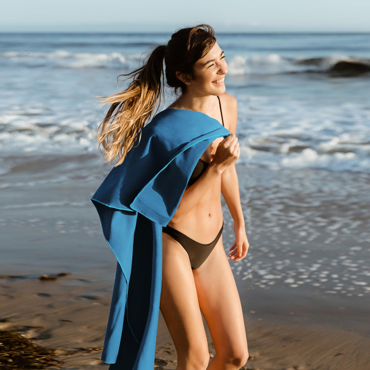 Hero Travel Supply blue microfiber towel drying after workout, ultra-soft and absorbent.