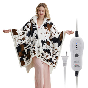 HESTIA cow-print hooded wearable blanket for cozy lounging with hands-free warmth.
