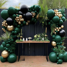 HIBAOpati black-green-gold balloon arch kit setup for a dramatic party centerpiece.