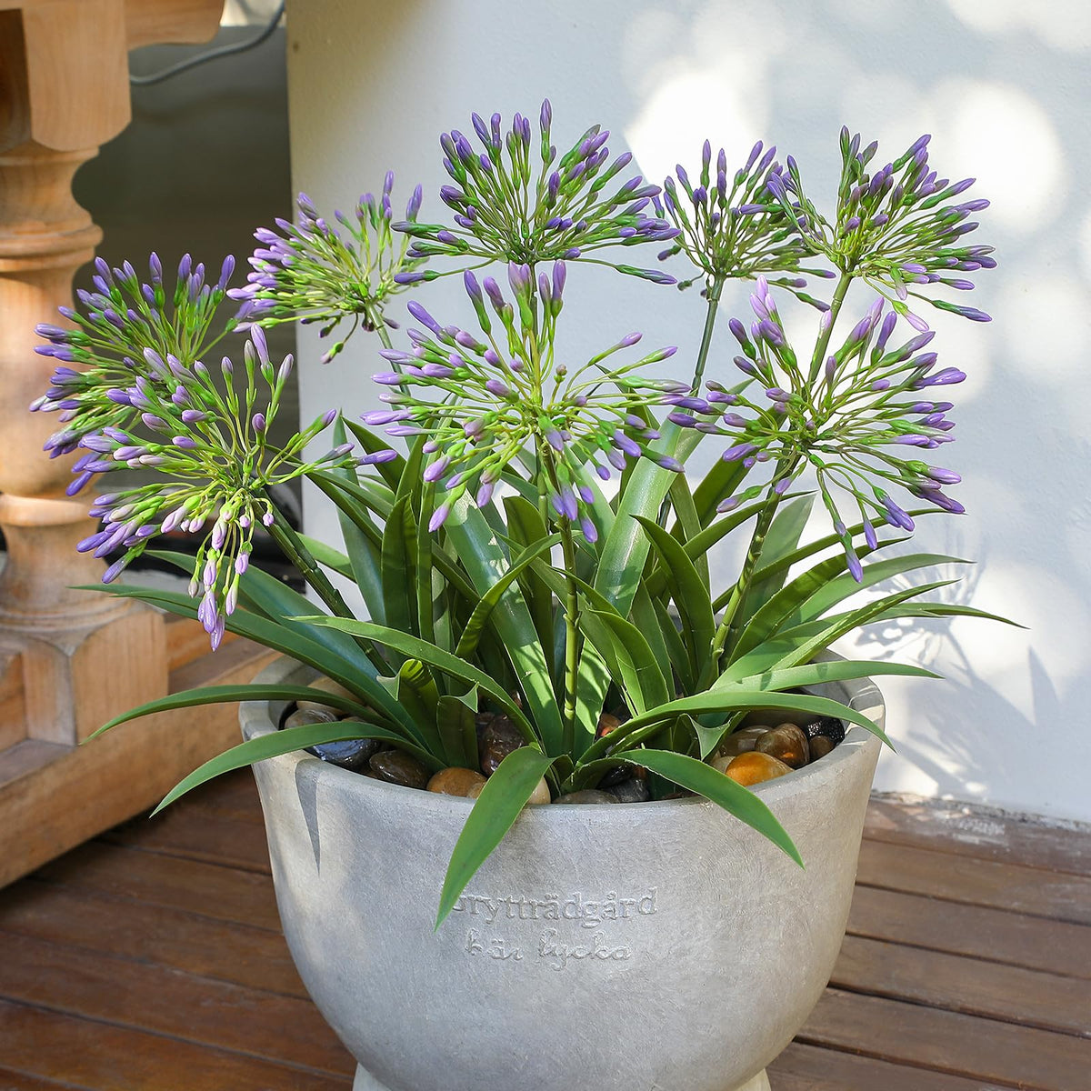 HIFORESTAR porch decor using outdoor-ready artificial flowers that stay vibrant year-round.