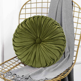 HIG Ripple olive round pillow on bed softens the room mood